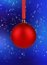 Image of Beautiful red Christmas ball hanging on blue background