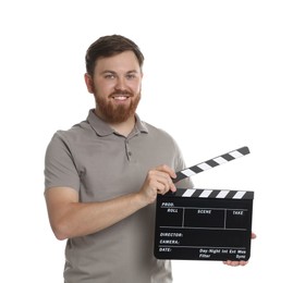 Photo of Making movie. Smiling man with clapperboard on white background