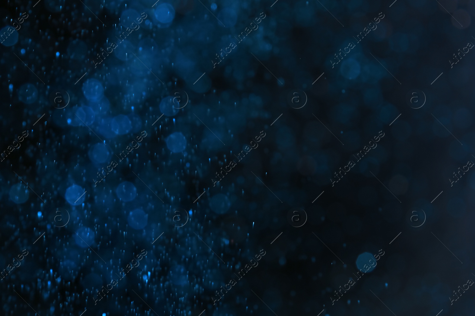 Photo of Color glitter on dark background. Bokeh effect