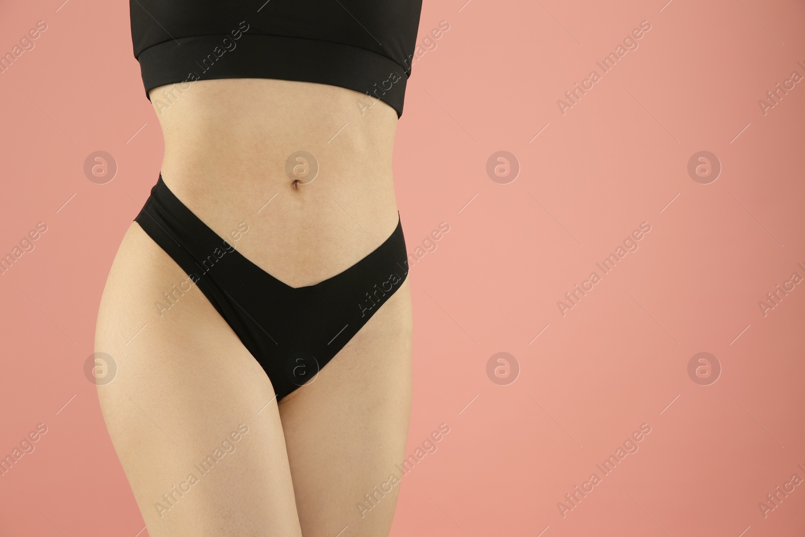 Photo of Gynecology. Woman in underwear on pink background, closeup. Space for text