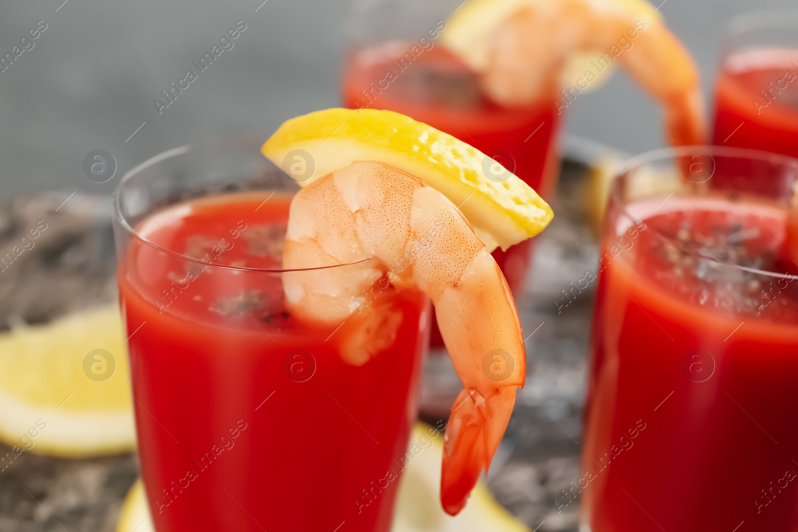 Photo of Delicious shrimp cocktail with tomato sauce, closeup