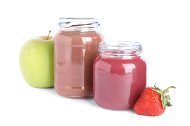 Baby food in jars and fresh ingredients on white background