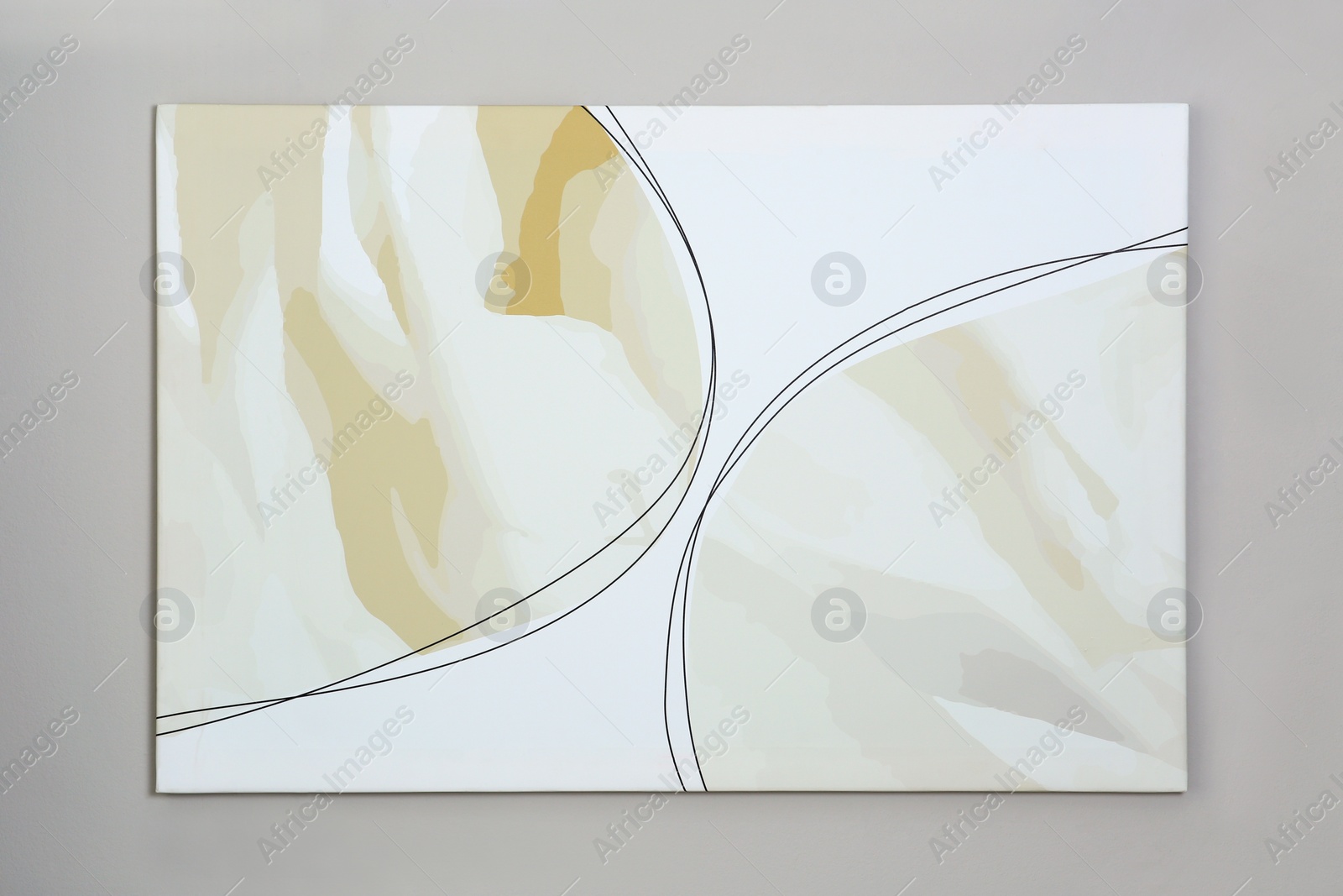 Photo of Beautiful abstract painting hanging on grey wall