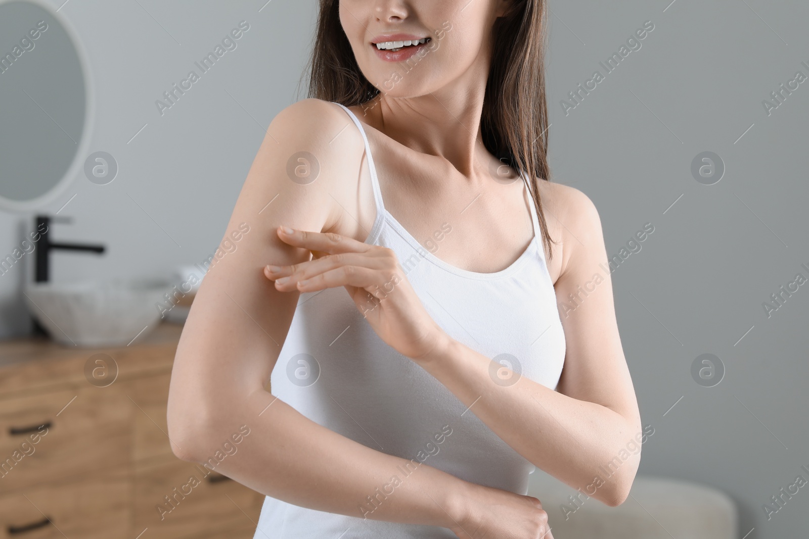 Photo of Woman with smooth skin in bathroom, closeup