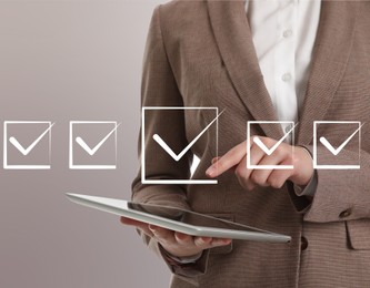 Image of Illustration of check boxes with marks and woman using tablet on light grey background, closeup