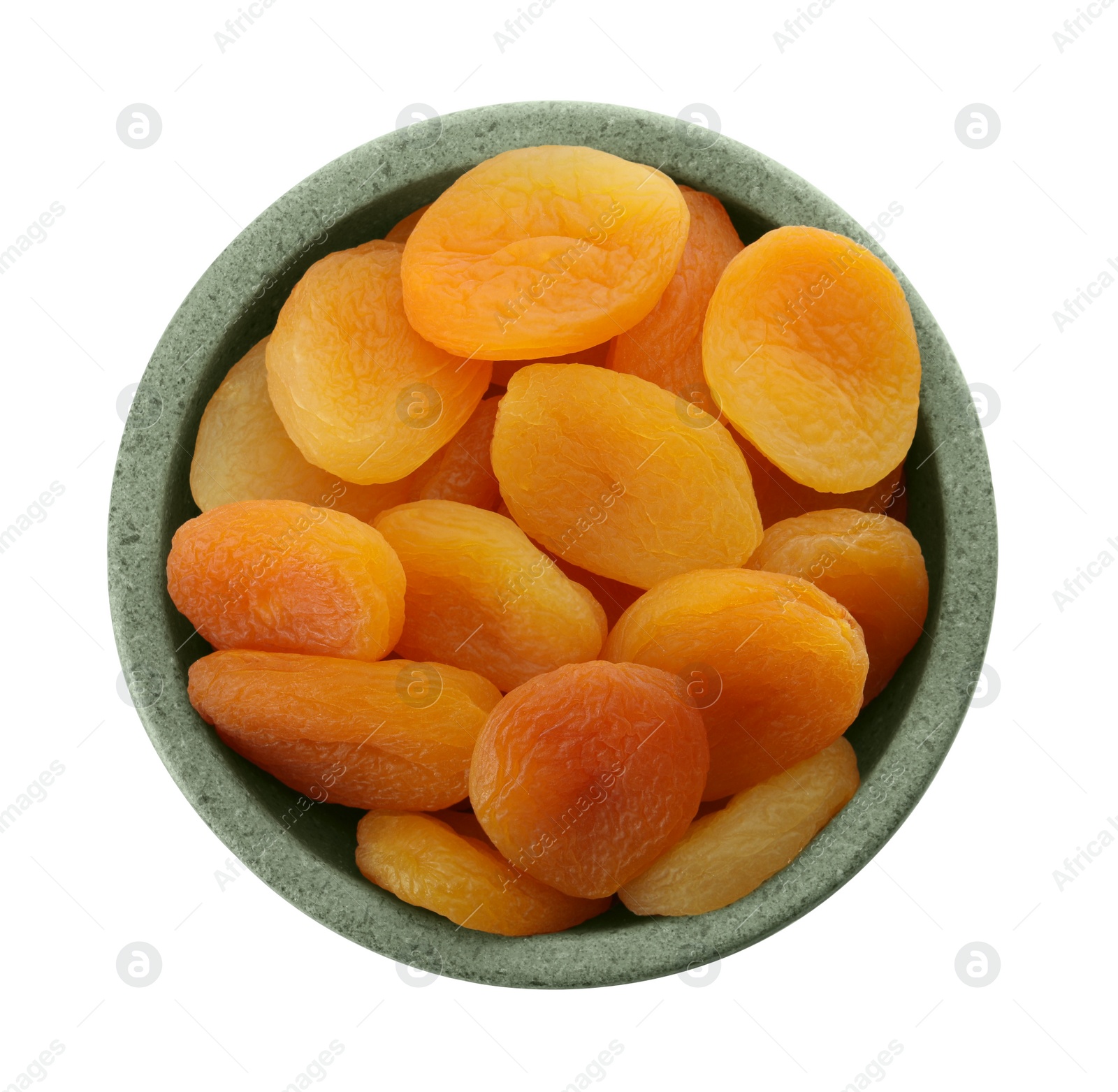 Photo of Ceramic bowl with tasty dried apricots isolated on white, top view