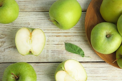 Photo of Flat lay composition of fresh ripe green apples on white wooden table