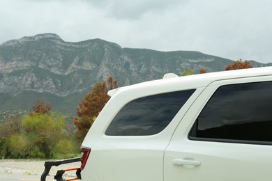 Beautiful view of mountains and car outdoors. Road trip