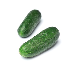 Photo of Ripe cucumbers on white background. Healthy diet