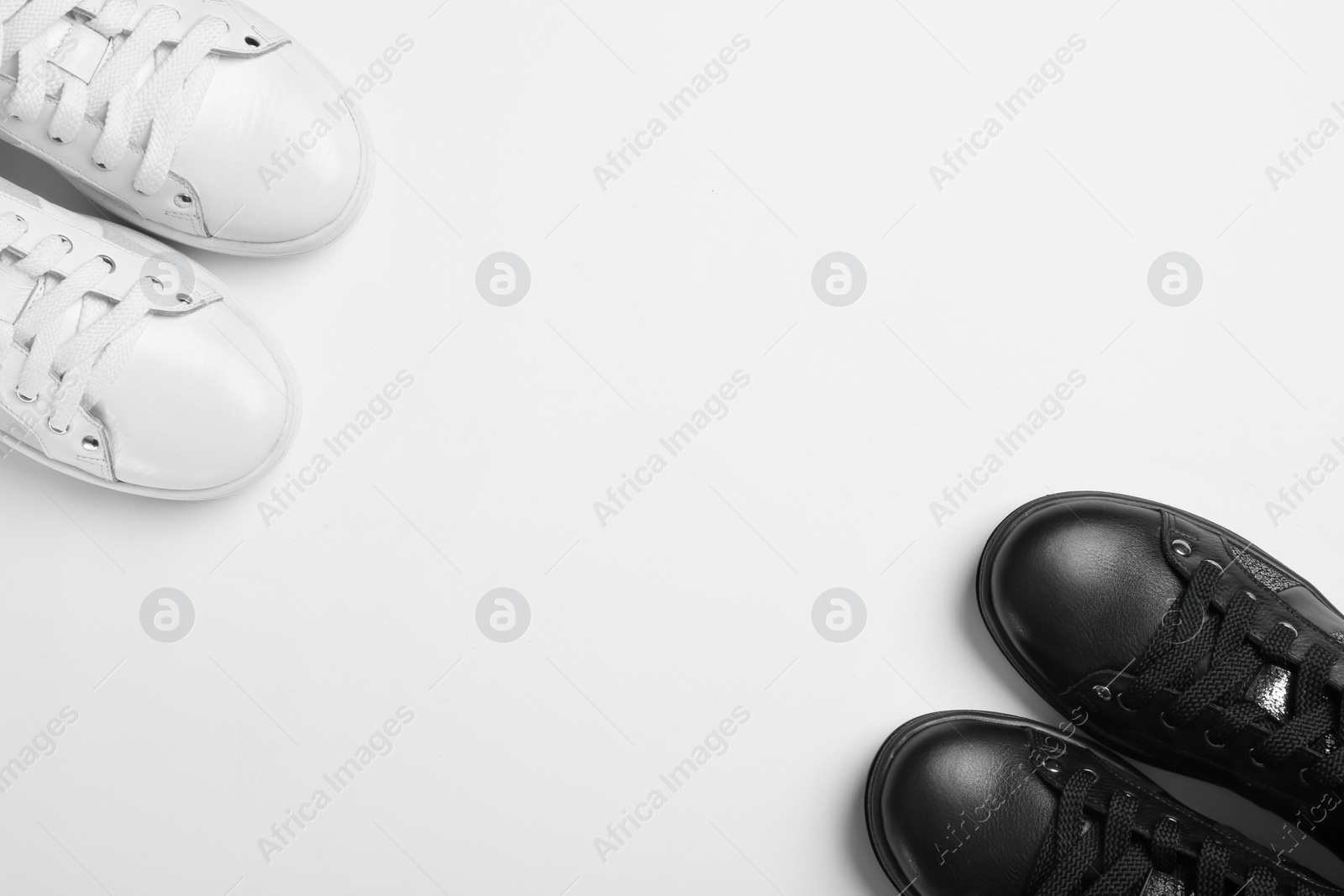 Photo of Flat lay composition of stylish shoes on white background