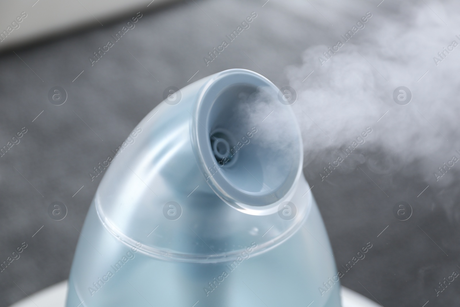 Photo of Modern air humidifier at home, closeup view