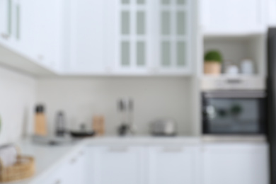 Photo of Blurred view of modern stylish kitchen interior