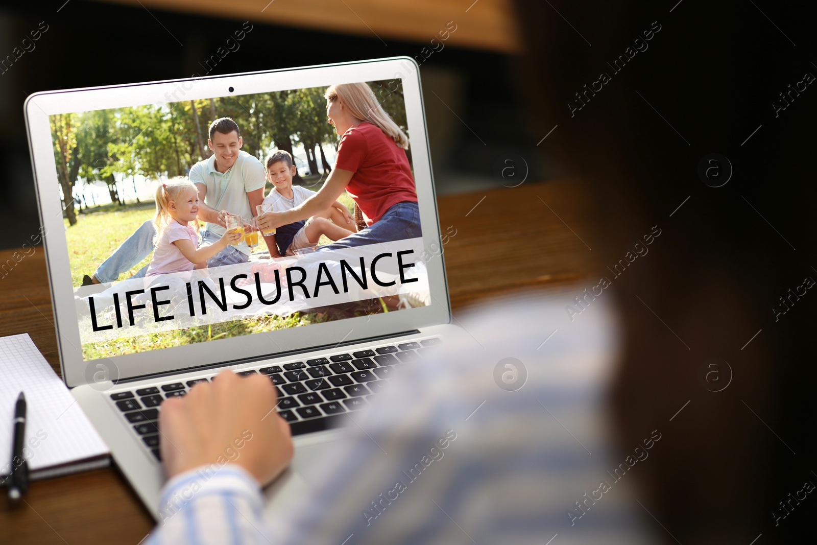 Image of Woman with modern laptop indoors, closeup. Life insurance