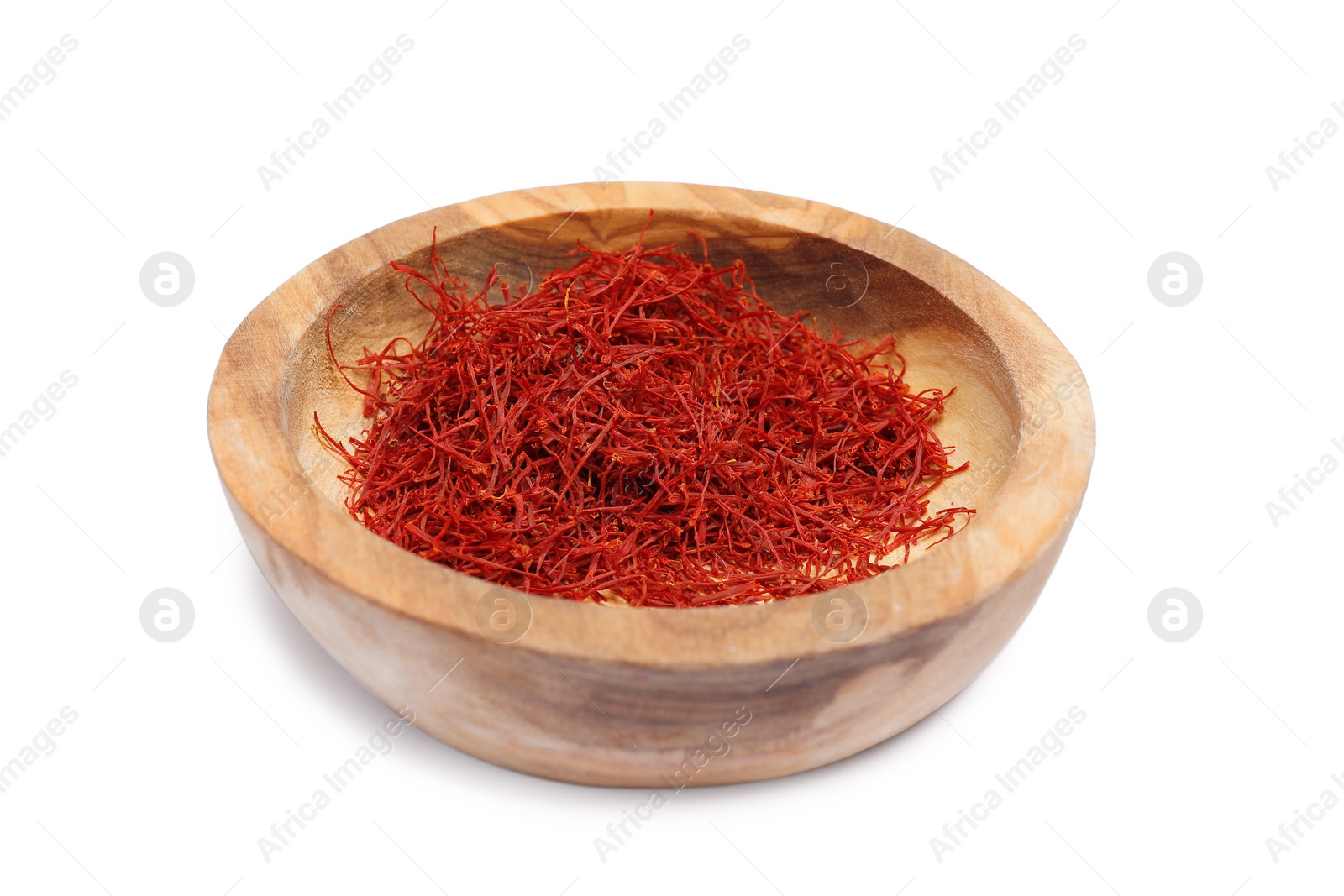 Photo of Aromatic saffron in bowl isolated on white