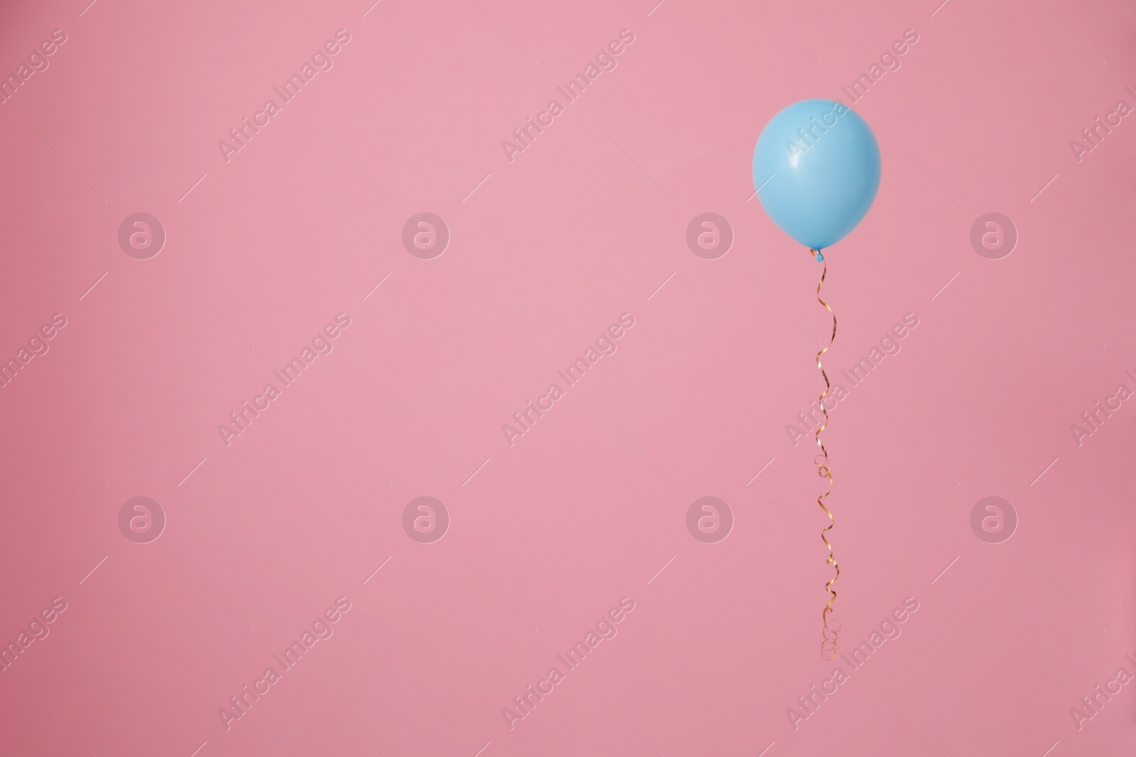 Photo of Bright balloon on color background, space for text. Celebration time