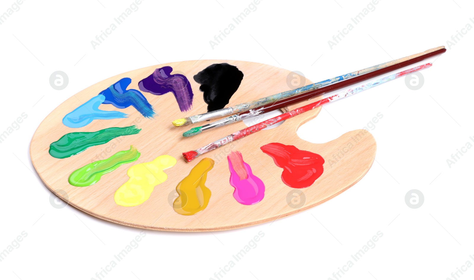 Photo of Palette with paints and brushes on white background. Artist equipment