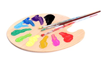 Palette with paints and brushes on white background. Artist equipment