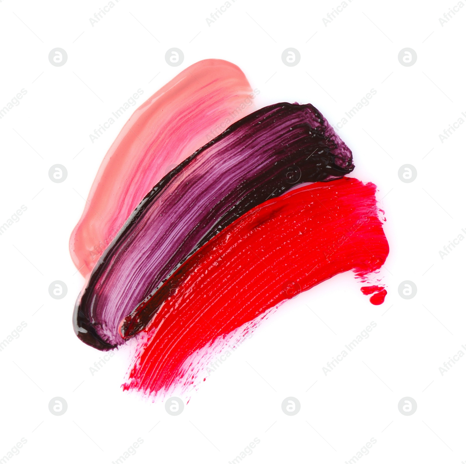 Photo of Strokes of different lip glosses isolated on white, top view