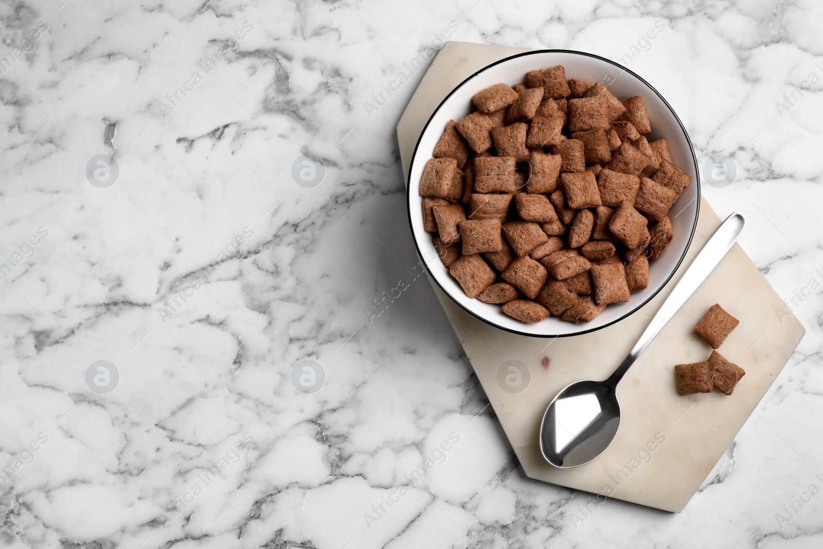 Photo of Delicious chocolate corn pads on white marble table, top view. Space for text