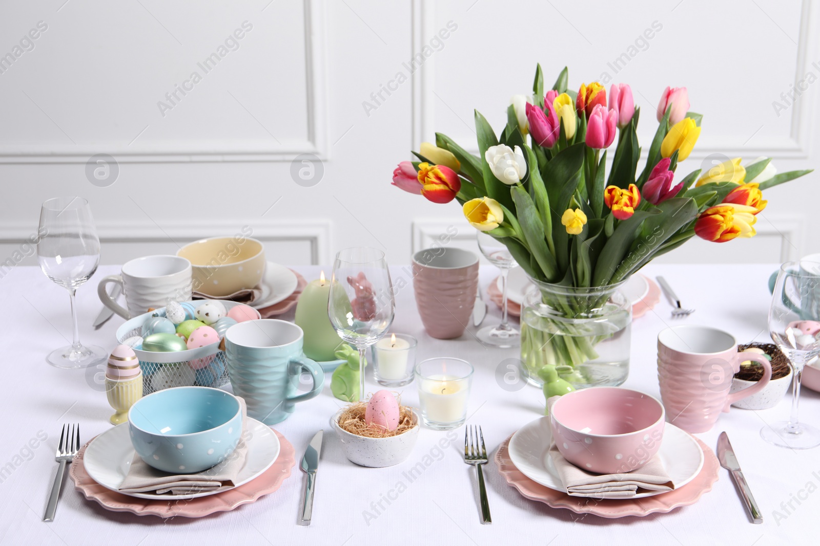 Photo of Festive table setting with beautiful flowers. Easter celebration