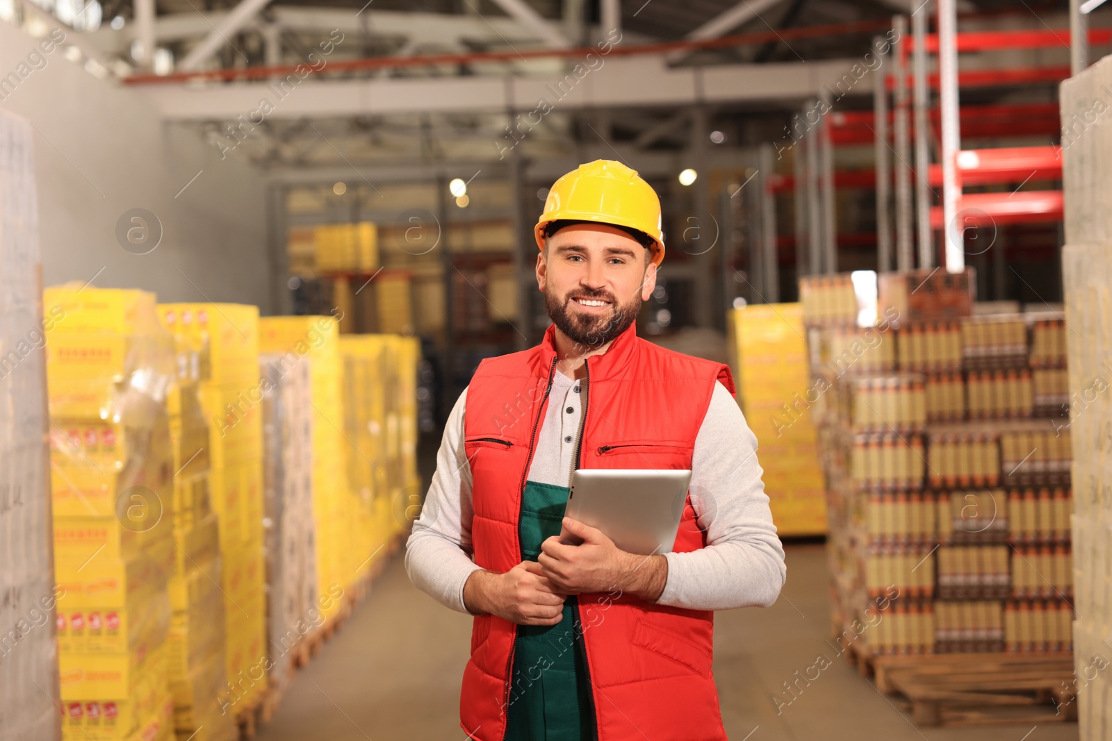 Image of Man with tablet working at warehouse. Logistics center