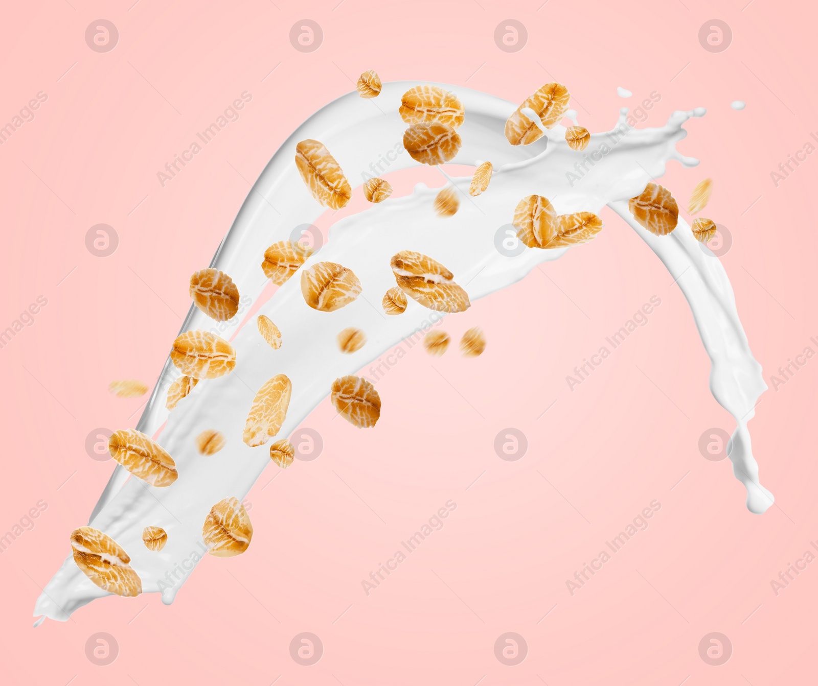 Image of Rolled oats and milk splash on pink background