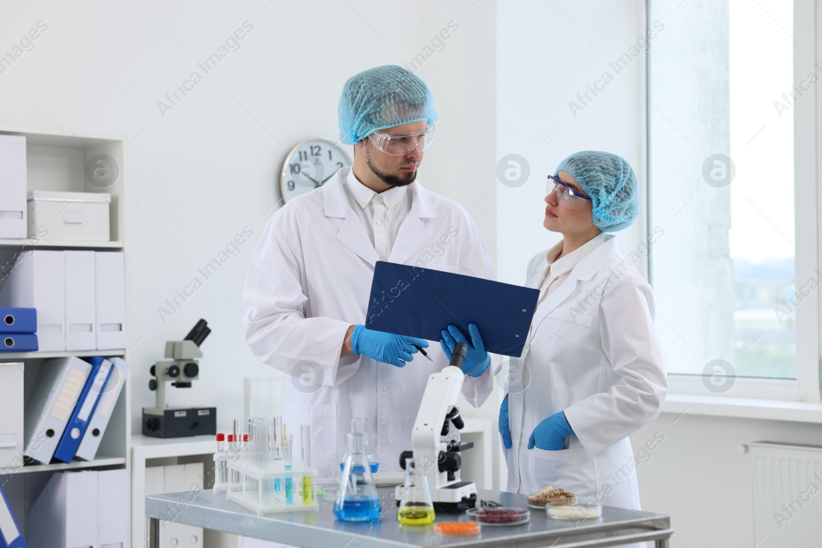 Photo of Quality control. Food inspectors checking safety of products in laboratory