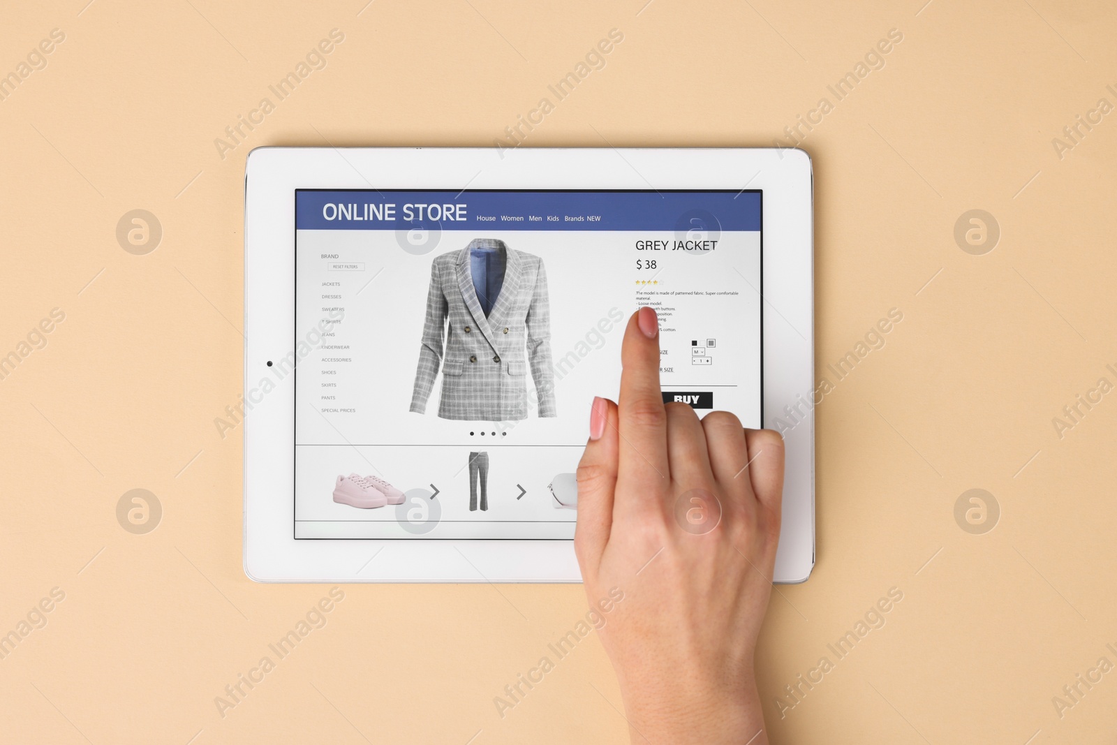 Photo of Woman with tablet shopping online on beige background, top view