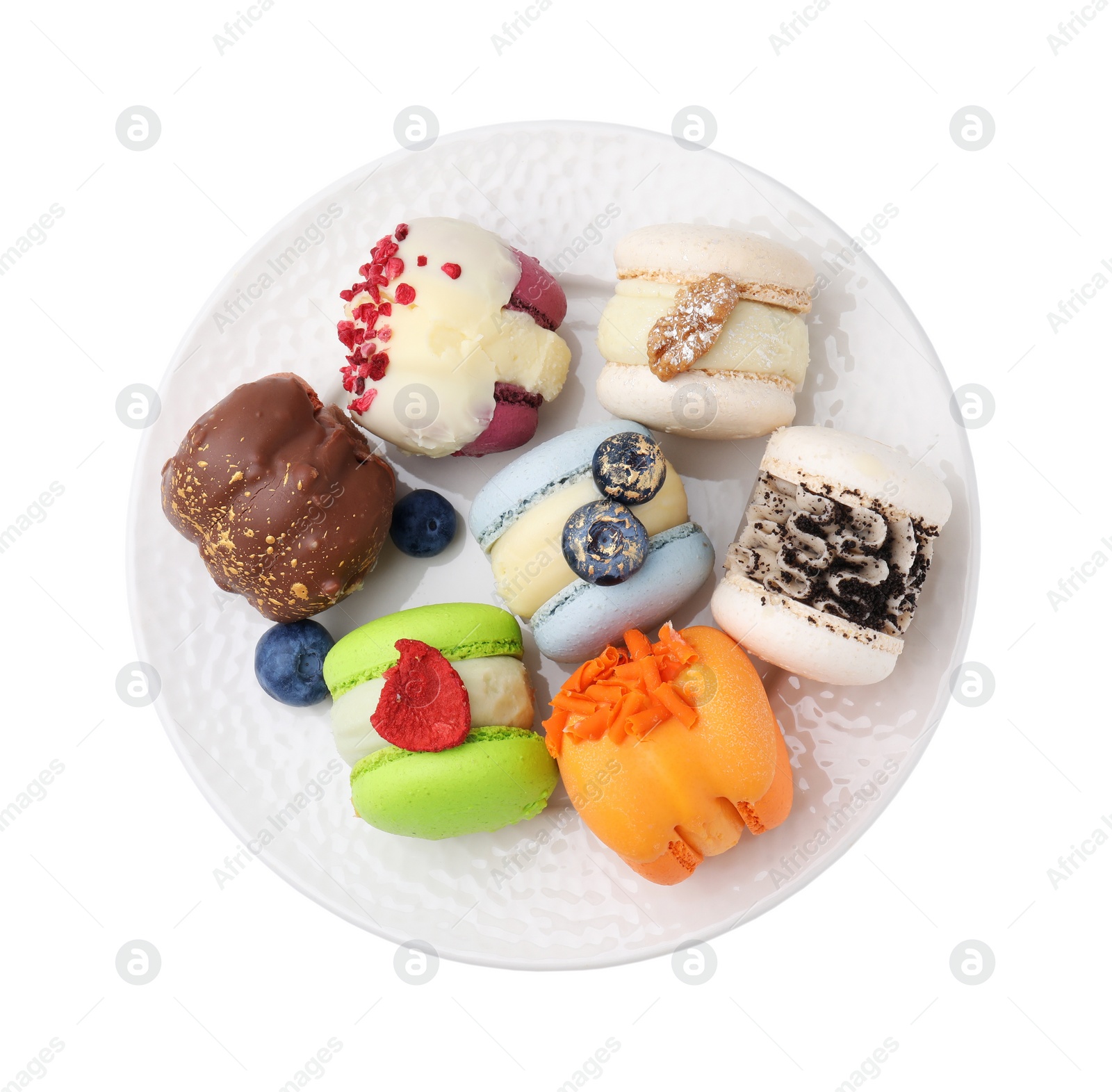 Photo of Plate with delicious macarons and blueberries isolated on white, top view