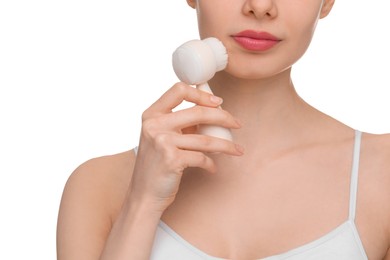 Photo of Washing face. Young woman with cleansing brush on white background, closeup