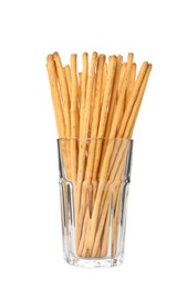 Photo of Delicious grissini sticks in glass on white background