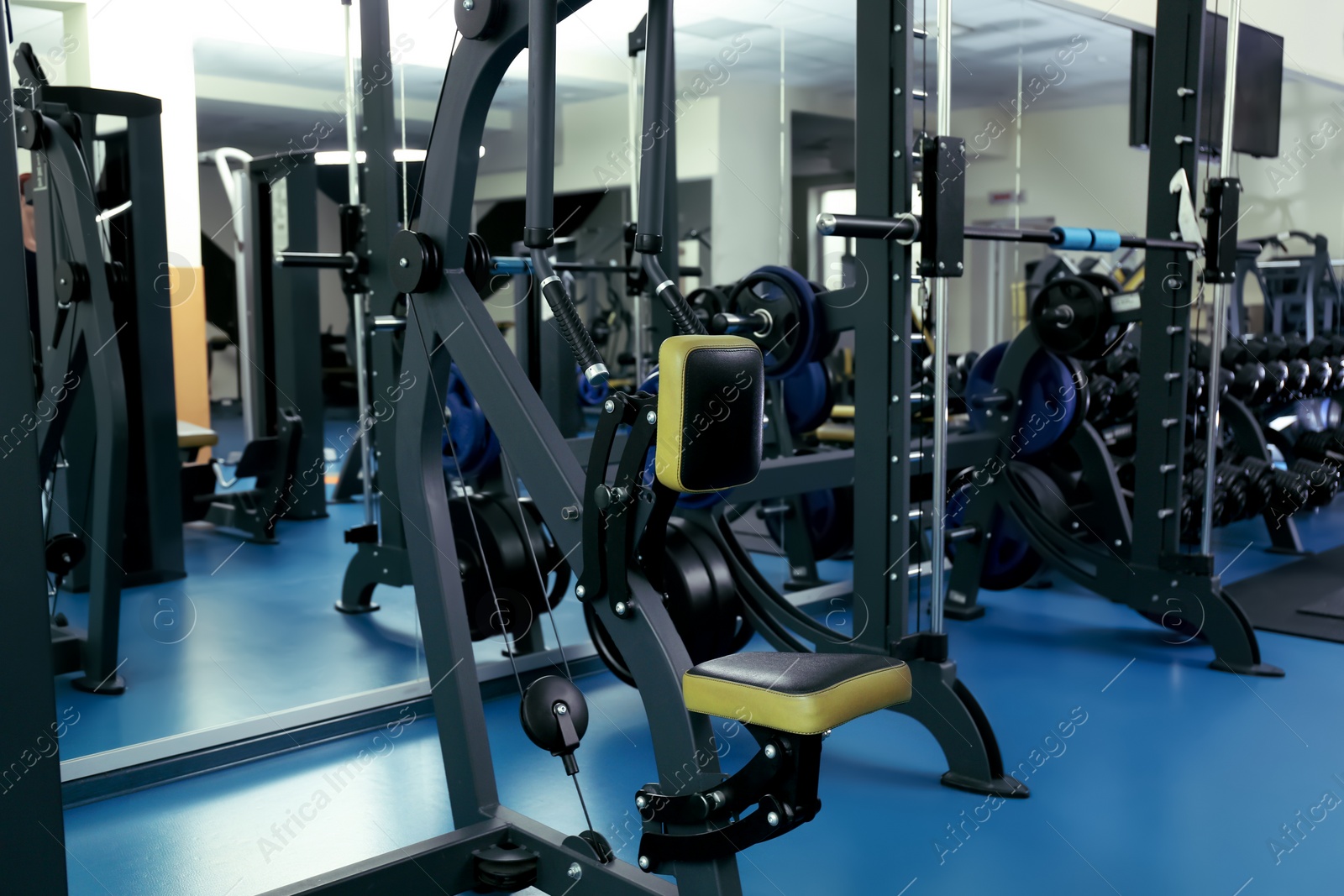 Photo of Interior of modern gym with new equipment