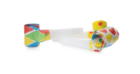 Photo of Bright party blowers on white background. Festive items