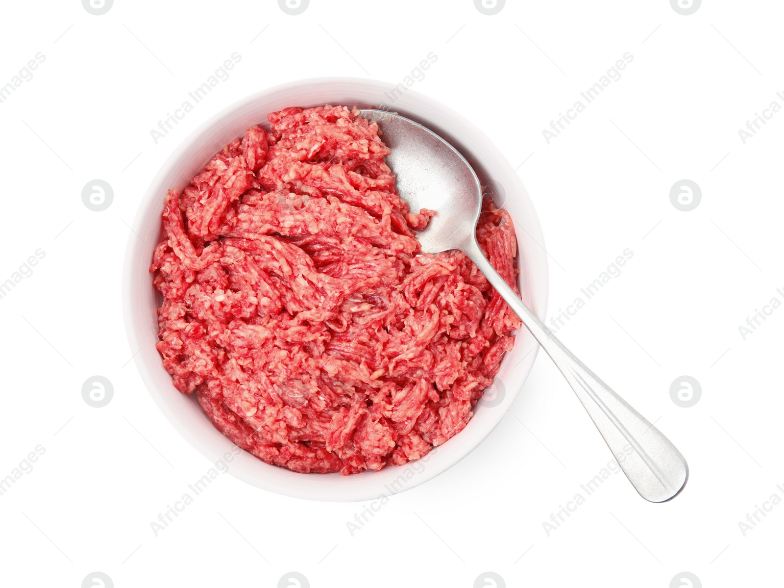 Photo of Fresh minced meat and spoon in bowl on white background, top view