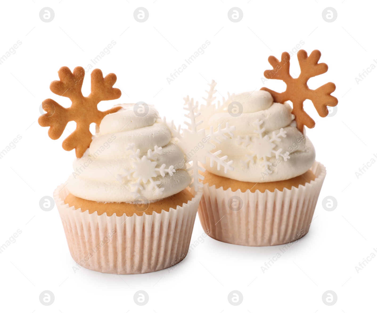 Photo of Tasty Christmas cupcakes with snowflakes on white background