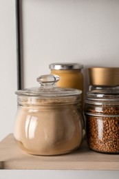 Photo of Flour and buckwheat in glass jars on shelf