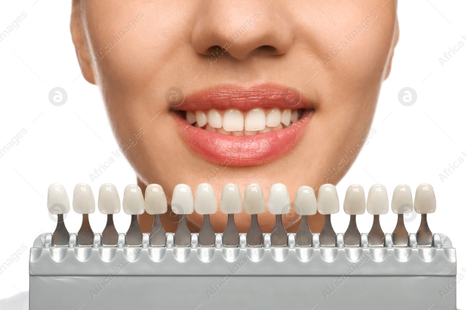 Photo of Woman checking her teeth color on white background, closeup. Cosmetic dentistry