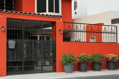 Photo of Entrance of yard with beautiful black metal door