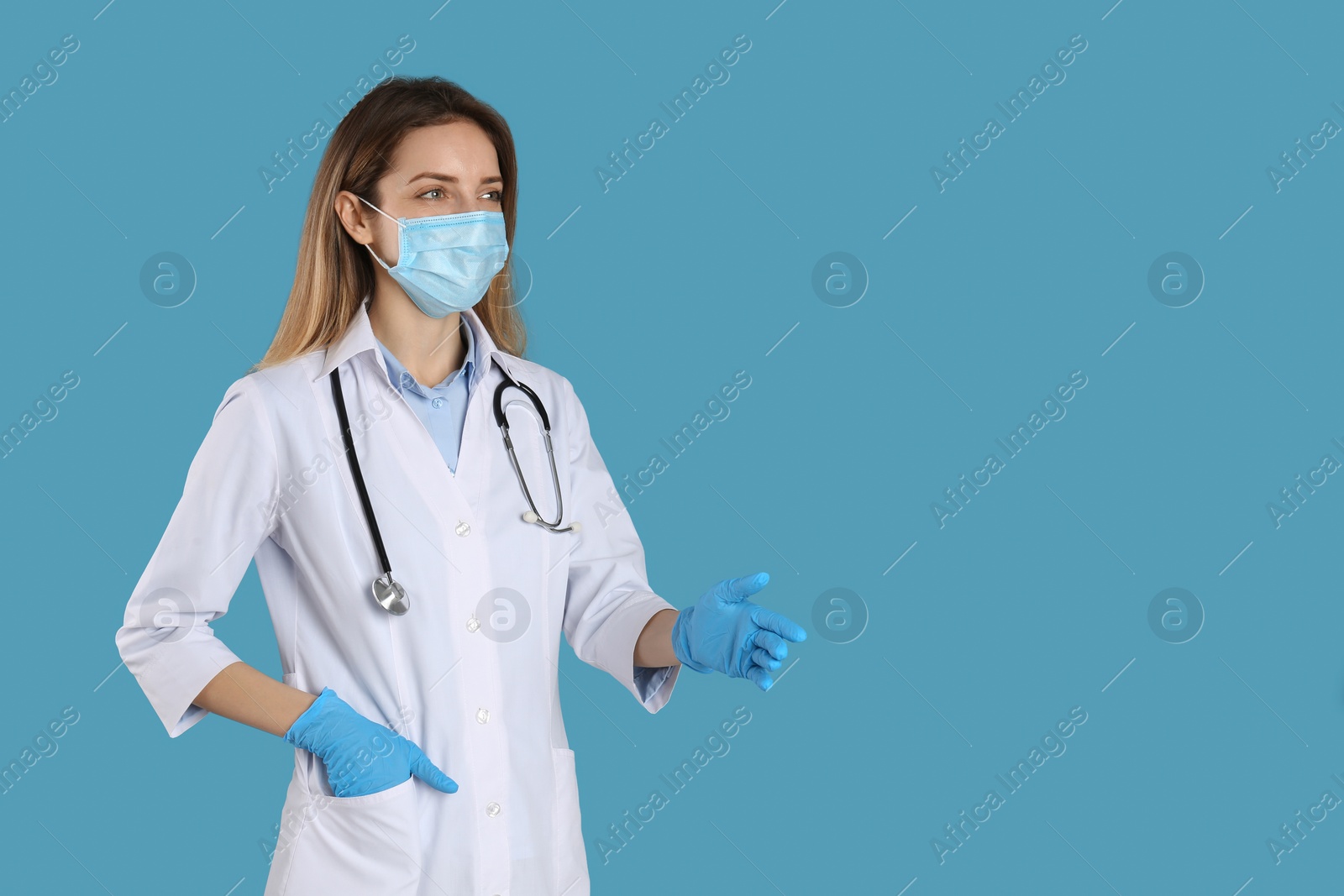 Photo of Doctor in protective mask and gloves offering handshake on light blue background. Space for text