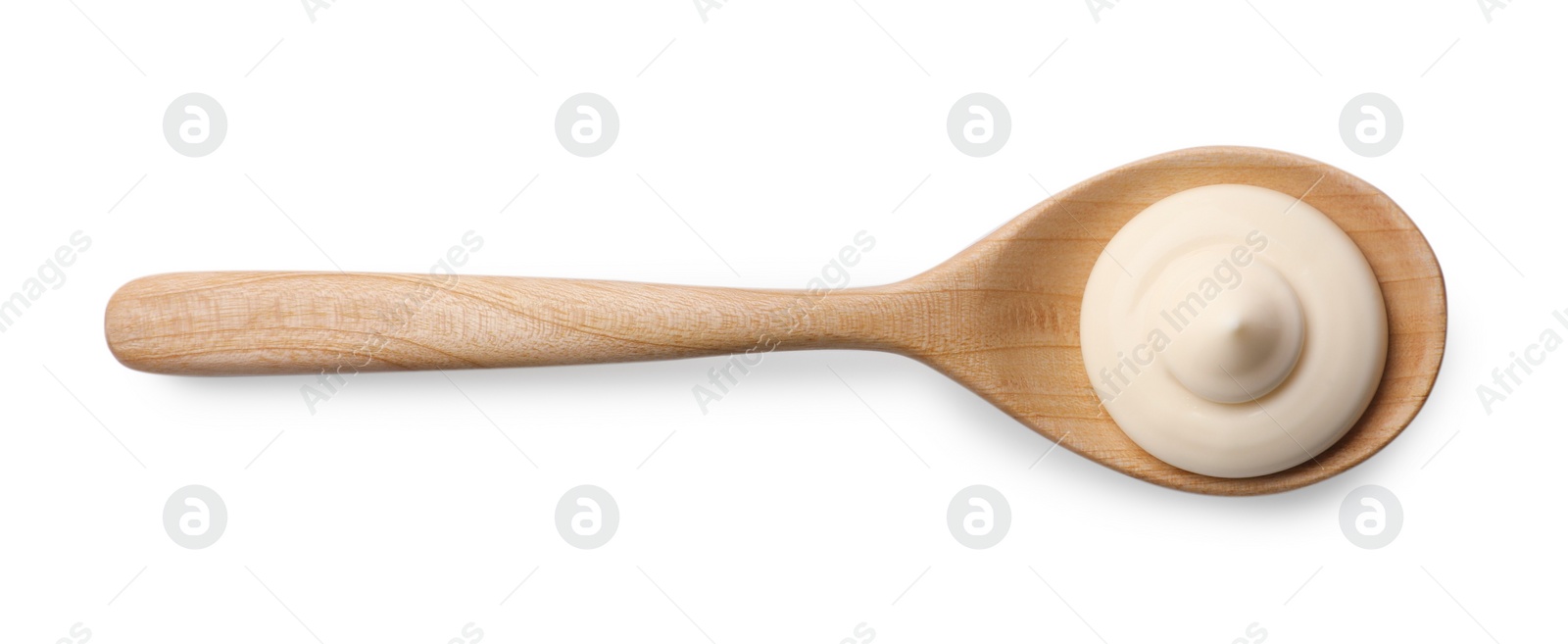 Photo of Natural yogurt in wooden spoon isolated on white, top view