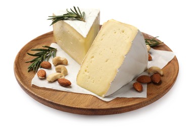 Plate with pieces of tasty camembert cheese, nuts and rosemary isolated on white