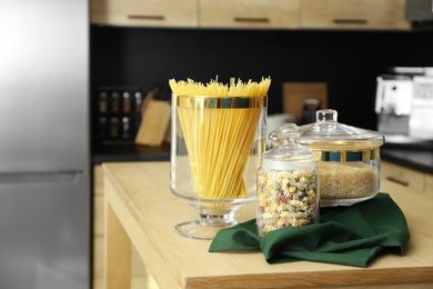 Photo of Products on wooden table in modern kitchen