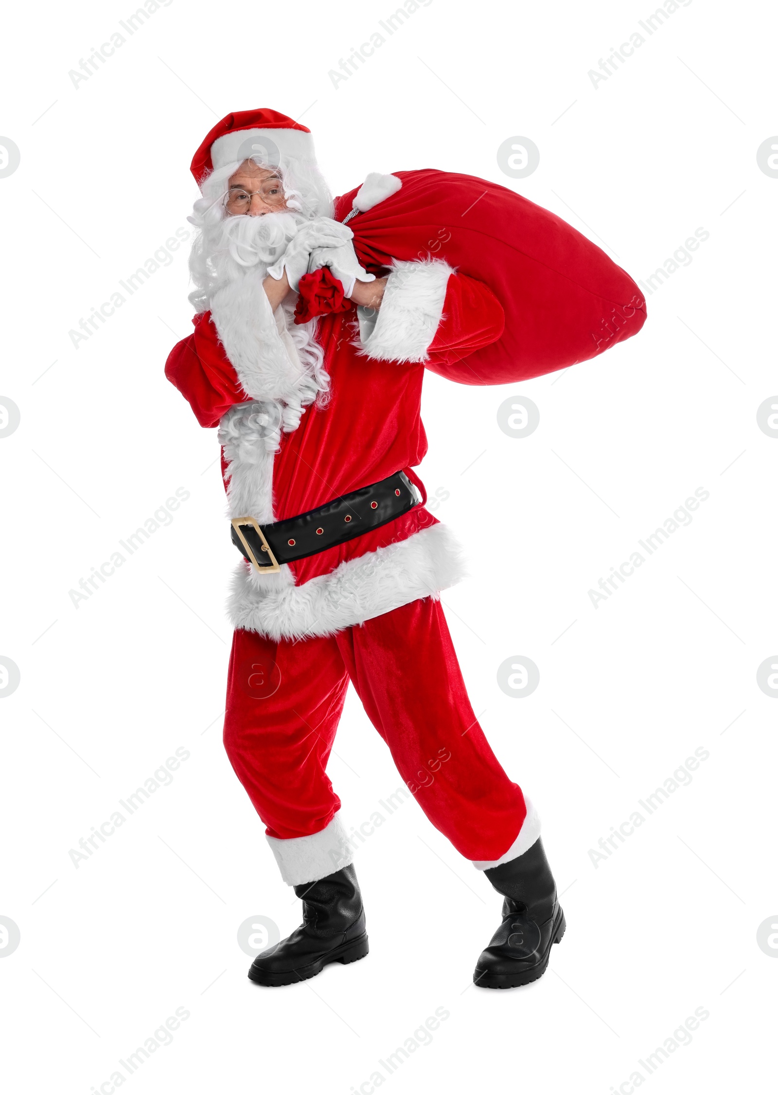 Photo of Man in Santa Claus costume with bag posing on white background