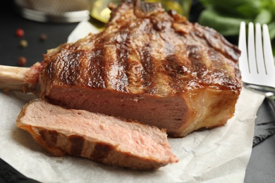 Image of Tasty grilled steak served on table, closeup