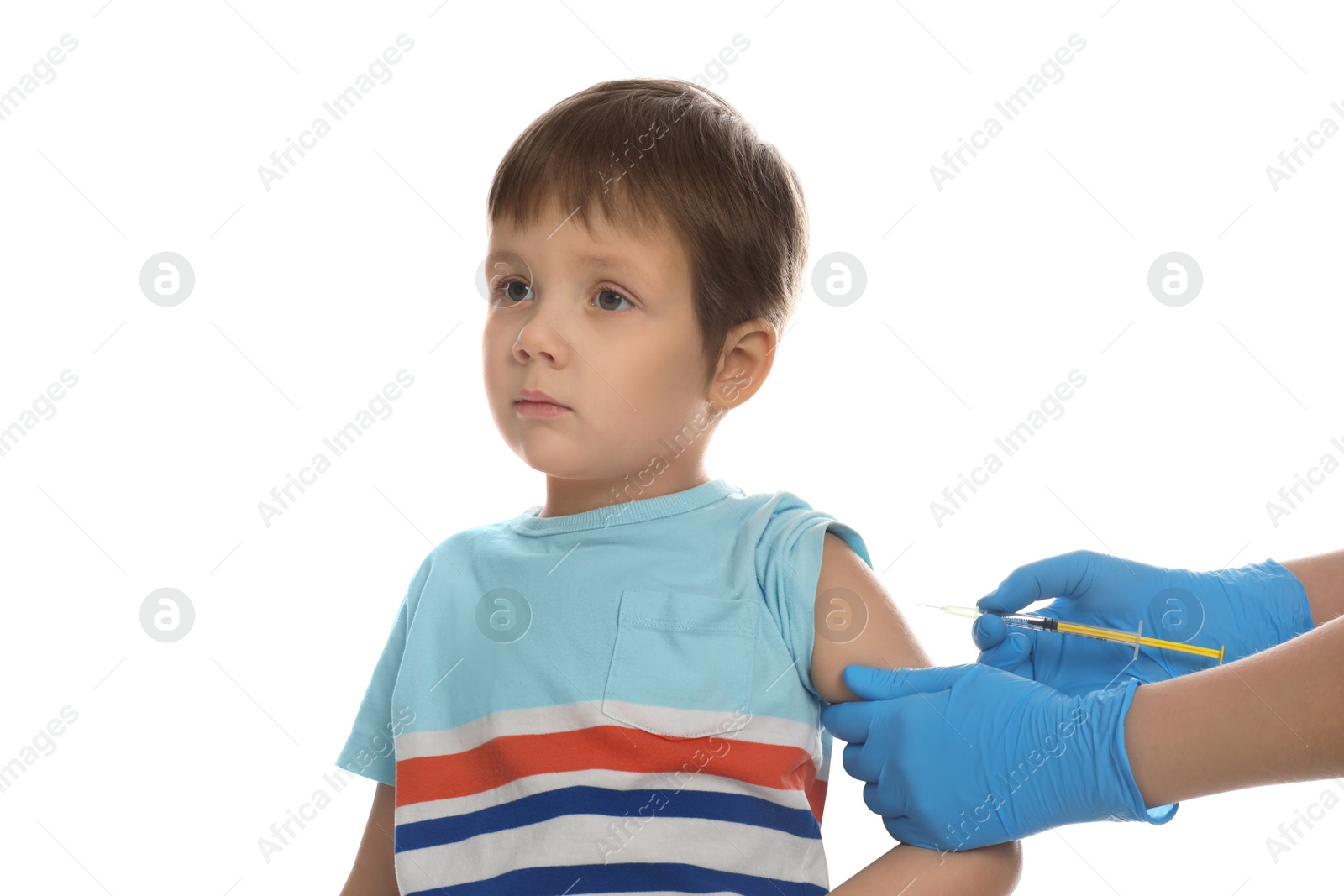 Photo of Doctor vaccinating little boy on white background