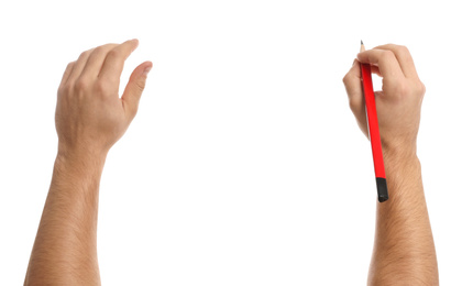 Photo of Man holding pencil on white background, closeup of hands