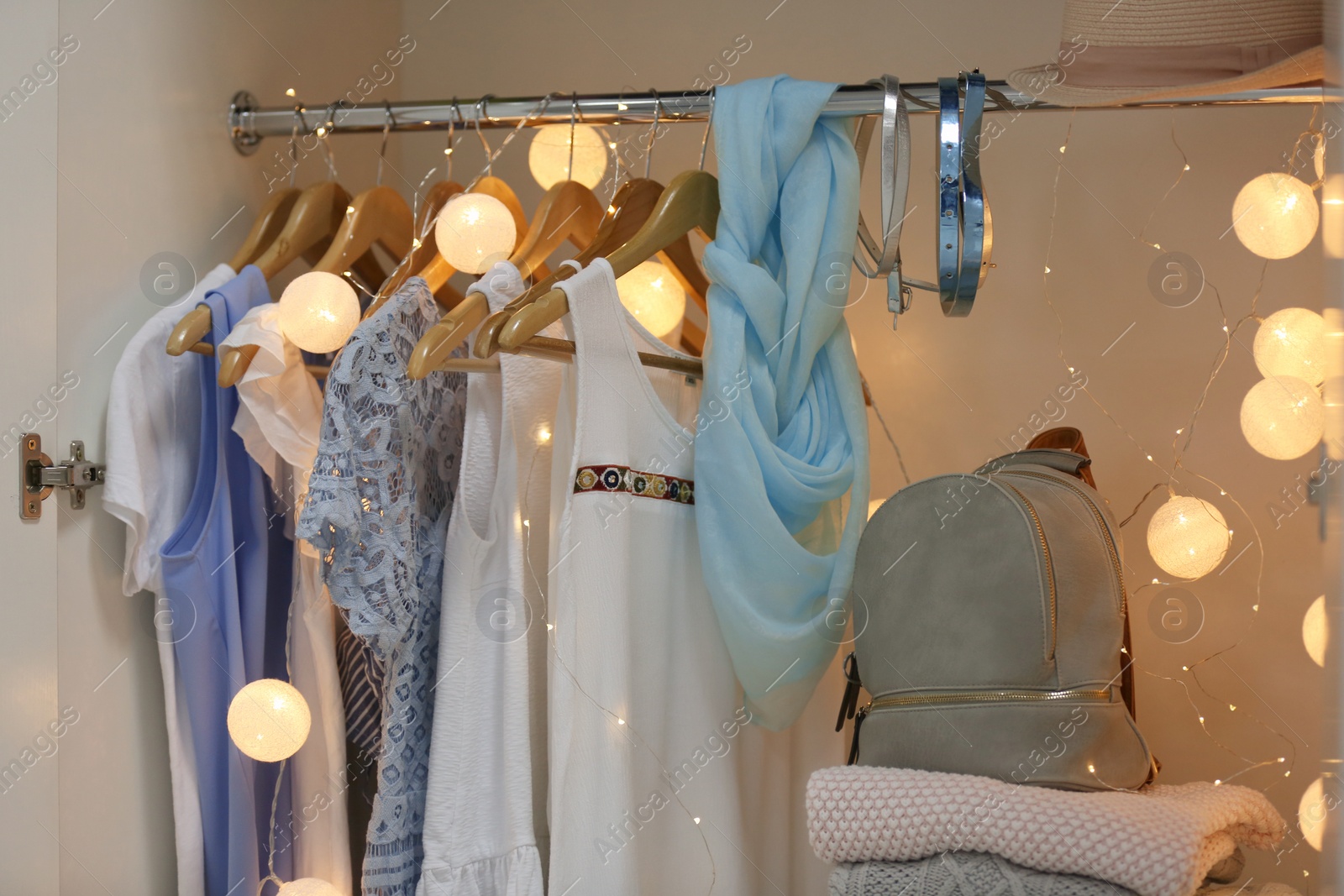 Photo of Women clothing on hangers in wardrobe