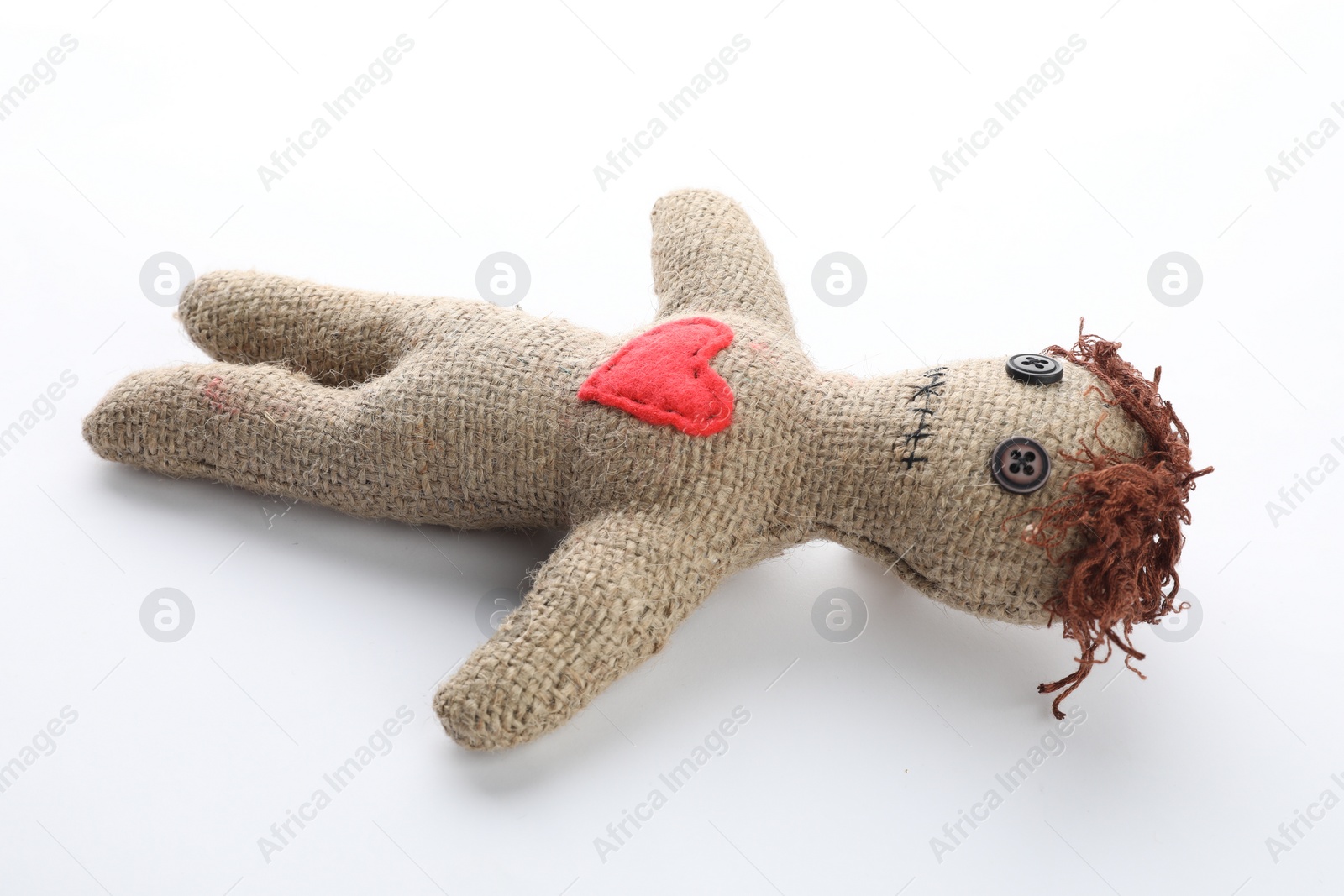 Photo of Voodoo doll with red heart isolated on white