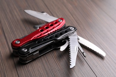 Modern compact portable multitool on wooden table