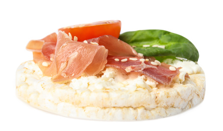 Photo of Puffed rice cake with prosciutto, tomato and basil isolated on white